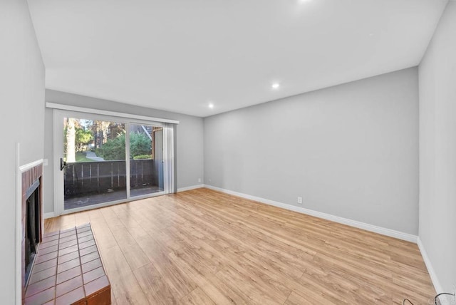 unfurnished living room featuring light wood-type flooring