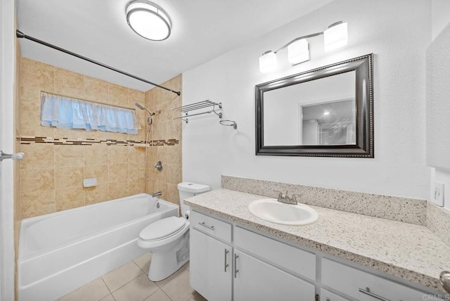 full bathroom with toilet, vanity, tile patterned floors, and tiled shower / bath