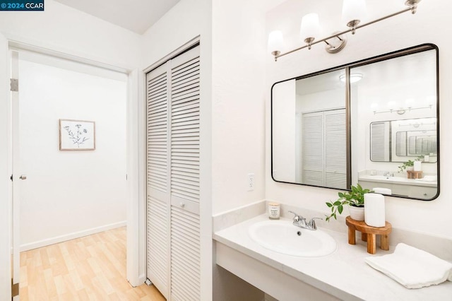 bathroom with sink and hardwood / wood-style floors