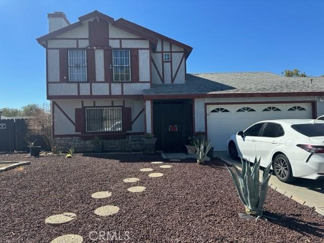 tudor home with a garage