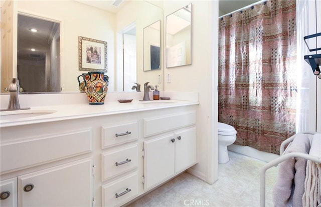 bathroom with toilet, vanity, and a shower with shower curtain