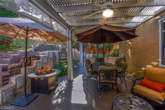 view of patio with an outdoor fire pit and a pergola