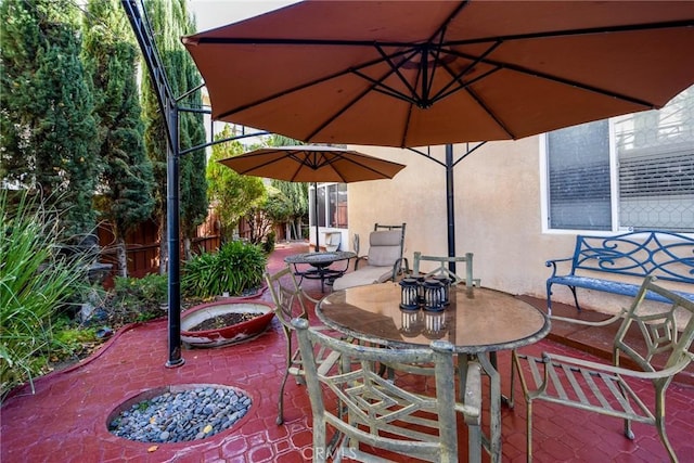 view of patio with an outdoor fire pit