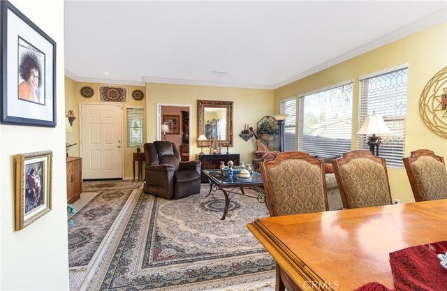 living room with ornamental molding