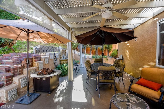 view of patio / terrace with a fire pit and a pergola