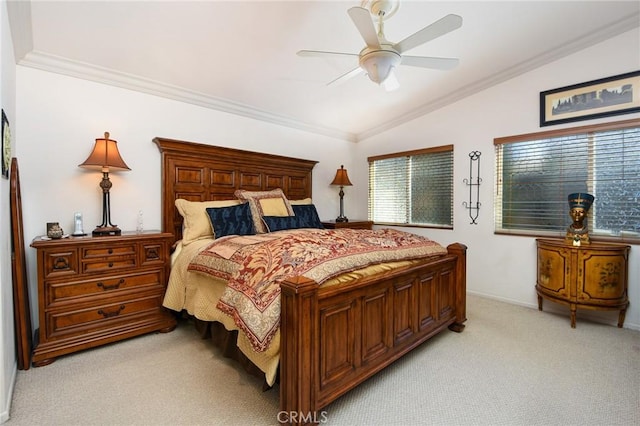 bedroom with vaulted ceiling, ceiling fan, crown molding, and light colored carpet