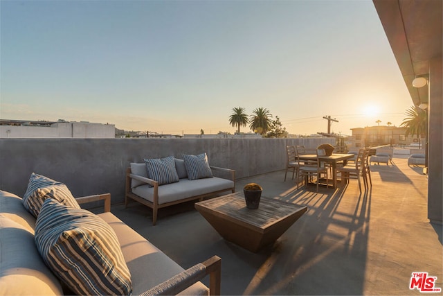 patio terrace at dusk with outdoor lounge area