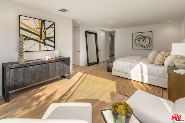 bedroom with light hardwood / wood-style flooring