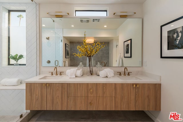 bathroom featuring a healthy amount of sunlight and vanity