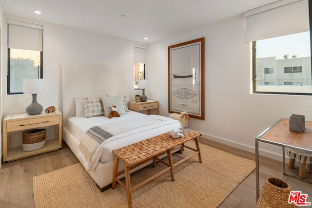 bedroom with light wood-type flooring