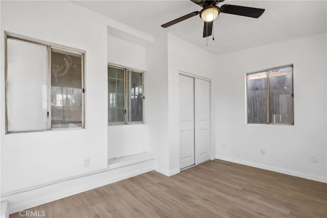 spare room featuring ceiling fan and hardwood / wood-style floors