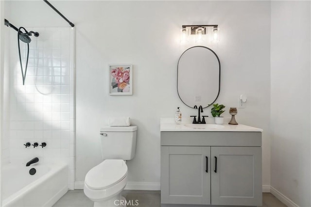 full bathroom with toilet, tiled shower / bath, and vanity