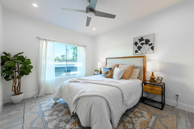 bedroom featuring ceiling fan and light hardwood / wood-style floors