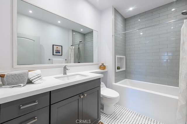 full bathroom featuring toilet, vanity, and shower / tub combo with curtain