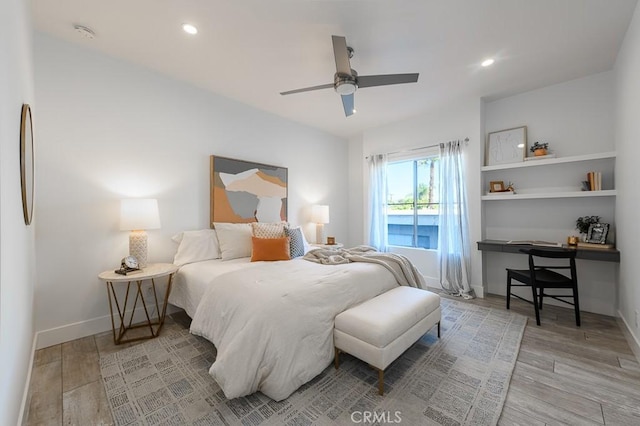 bedroom with hardwood / wood-style flooring and ceiling fan