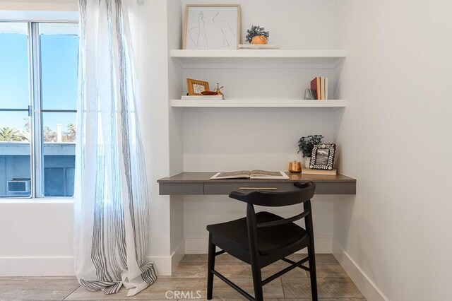 office with hardwood / wood-style flooring