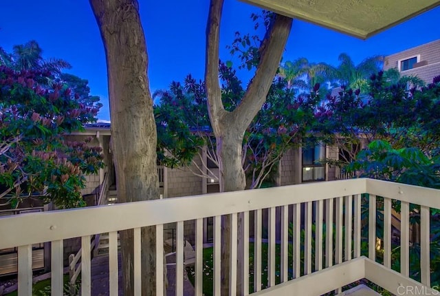 view of balcony at dusk