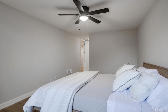 bedroom featuring ceiling fan and wood-type flooring