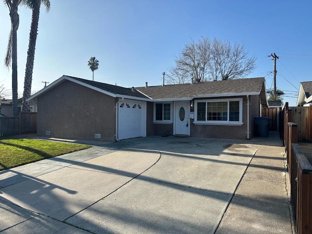 single story home with a front yard and a garage