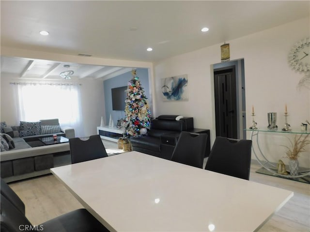 interior space featuring recessed lighting, light wood-type flooring, and visible vents