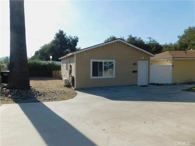 view of property exterior featuring fence