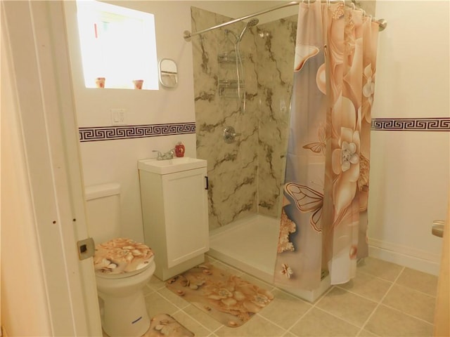 full bathroom featuring a sink, toilet, a shower stall, and tile patterned flooring