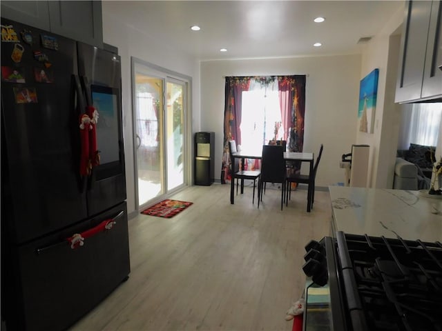 dining room featuring recessed lighting, visible vents, and light wood-style flooring