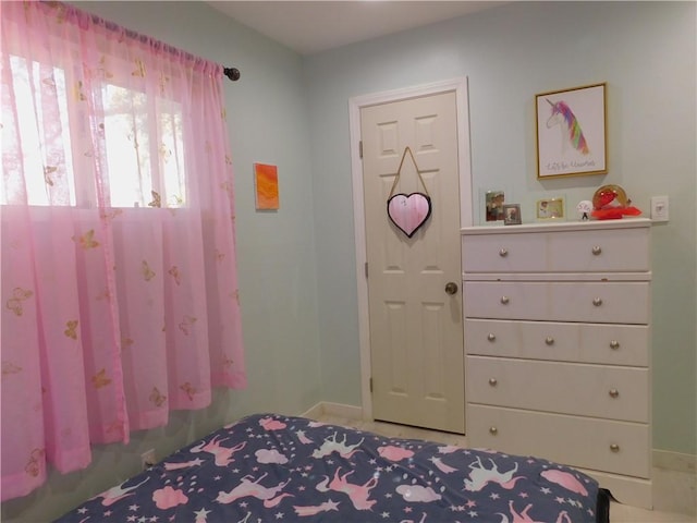 bedroom featuring baseboards