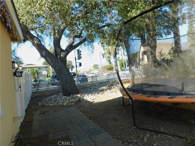 view of yard with a trampoline