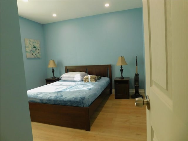 bedroom featuring recessed lighting and light wood finished floors