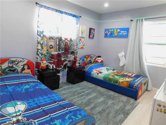 bedroom featuring wood finished floors and baseboards