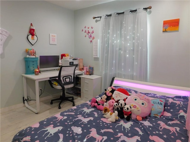 bedroom featuring wood finished floors