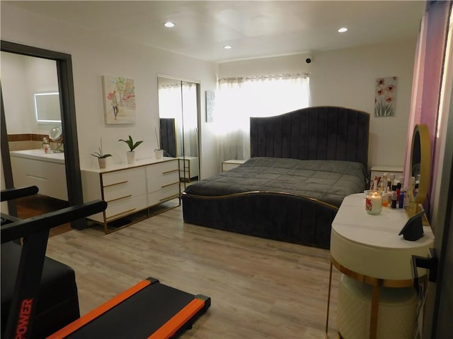 bedroom featuring light wood-style flooring and recessed lighting