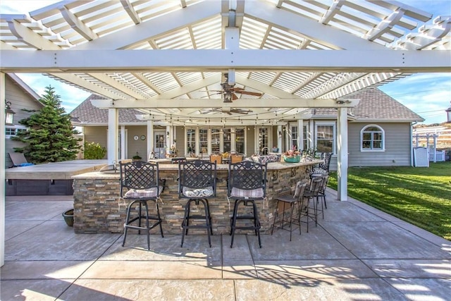 view of patio with a pergola and outdoor dry bar