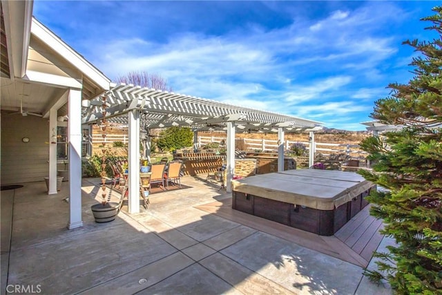 view of patio with a pergola, a covered hot tub, and outdoor dining space