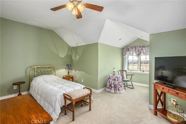 bedroom with baseboards, ceiling fan, and lofted ceiling