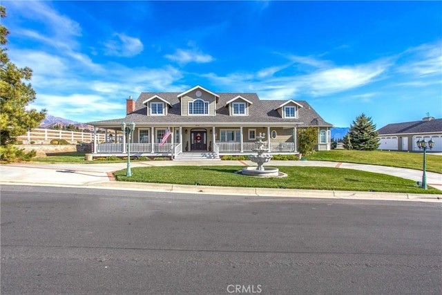 view of front of home featuring a front yard and a porch