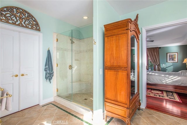 full bathroom with tile patterned floors, ensuite bathroom, a stall shower, and recessed lighting