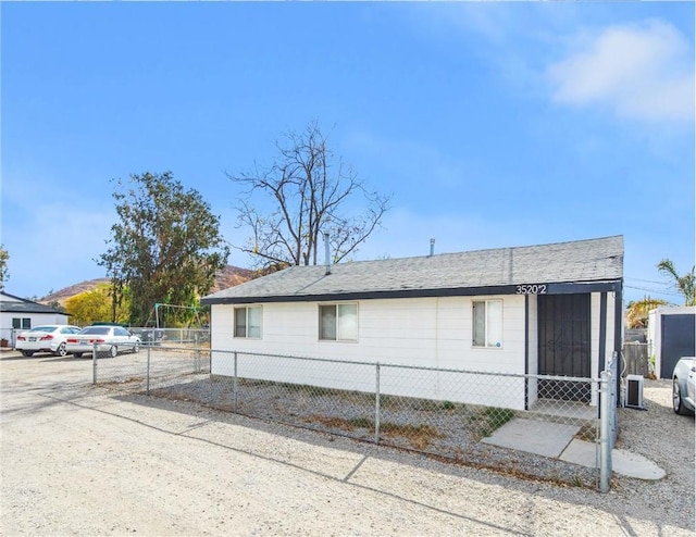 view of side of property featuring central AC unit