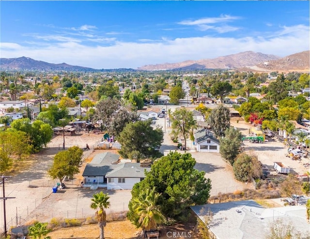 birds eye view of property with a mountain view