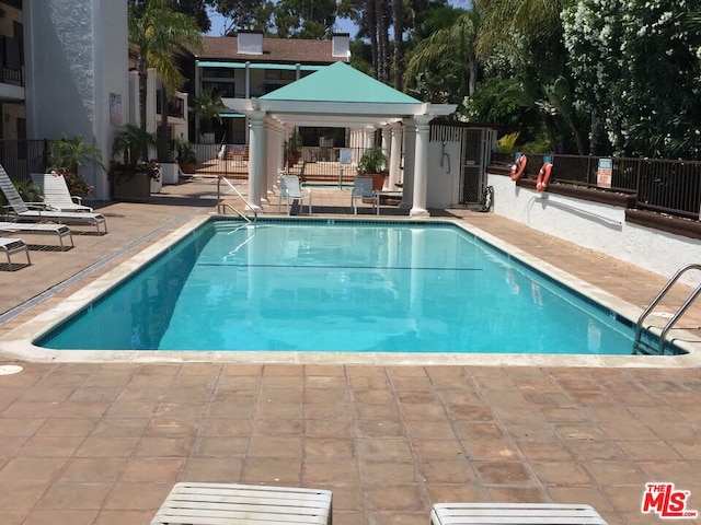 view of pool with a gazebo and a patio