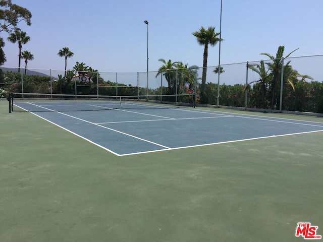 view of sport court with basketball hoop