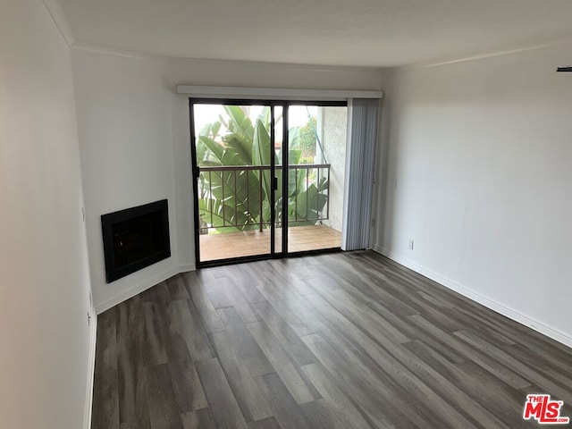 unfurnished living room with dark hardwood / wood-style floors