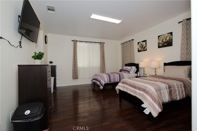 bedroom featuring dark hardwood / wood-style floors