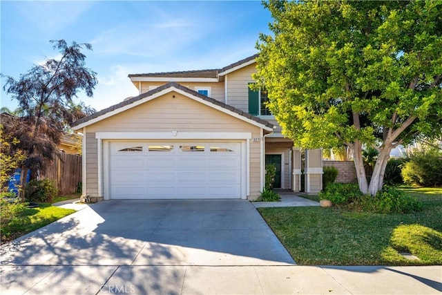 view of front of house featuring a front yard and a garage