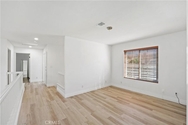 unfurnished room featuring light hardwood / wood-style flooring