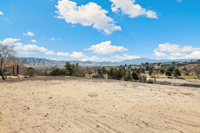 mountain view featuring a rural view