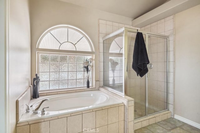 bathroom with shower with separate bathtub