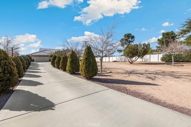 view of yard with a garage