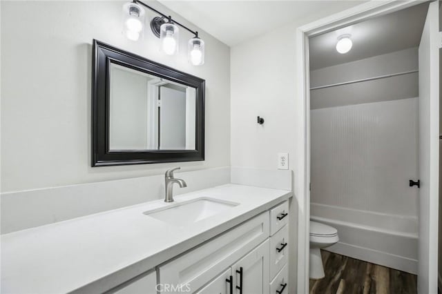 full bathroom featuring shower / bathtub combination, wood-type flooring, toilet, and vanity